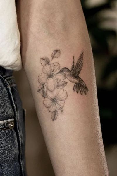 30+ Hummingbird Tattoo Designs for Graceful Ink - Tweakbee Hummingbird Tattoo With Flowers Color, Hummingbird Cactus Tattoo, Hibiscus Hummingbird Tattoo, Cardinal And Hummingbird Tattoo, Hummingbird Tattoo Forearm, Hummingbird Tattoo Fine Line, Realistic Hummingbird Tattoo, Hummingbird And Flower Tattoo, Hummingbird Sleeve Tattoo