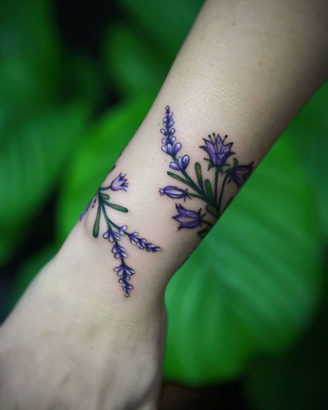 Guide to Flower Tattoos, Meaning, Design Ideas & Placements Violet Evergarden Tattoo Ideas, Daisy Tattoo On Wrist, Tiny Daisy Tattoo, Violets Tattoo, Flower Tattoo Placement, Purple Flower Tattoos, Violet Flower Tattoos, Lavender Bunch, Cute Tattoos With Meaning