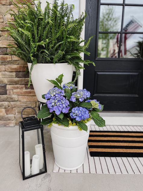 How to Style a Spring Front Porch - Life Love Larson Stoop Planter Ideas, Front Porch Hydrangeas Planters, Front Porch Container Plants, Flower Pots On Front Porch Steps, Potted Hostas Front Porches, Narrow Front Porch Decor, Small Front Step Decor, Front Porch Potted Plant Ideas, Front Step Decor