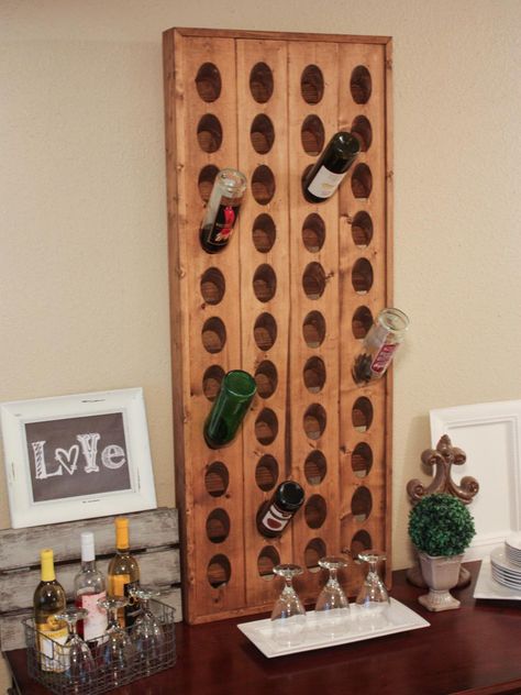 Display your vino in style with these clever ideas from HGTV.com. We've rounded up our favorite DIY wine racks and space-saving wine storage solutions. Wine Rack Projects, Riddling Rack, Wall Mounted Drying Rack, Wine Rack Design, Wine Bottle Wall, Pallet Wine, Farmhouse Pottery, Pottery Barn Inspired, Diy Plant Stand