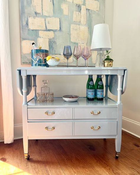 Heirloom House on Instagram: "Get ready to serve in style with the fabulous rolling cart! 🤩 Now available for sale.

Finished in a luxurious high gloss light blue paint with new polished brass hardware and a touch of PINK added to the silver drawer, this cart is ready to be the center of your next party! 🥂 Finished on both sides plus drop leaf ends makes it a versatile piece to move around your home!

Please message me with any questions :)" Blue Bar Cart, Light Blue Paint, Coffee Bar Cart, Fine Paints Of Europe, Light Blue Paints, College House, Bamboo Bar, Vintage Bar Carts, Blue Bar