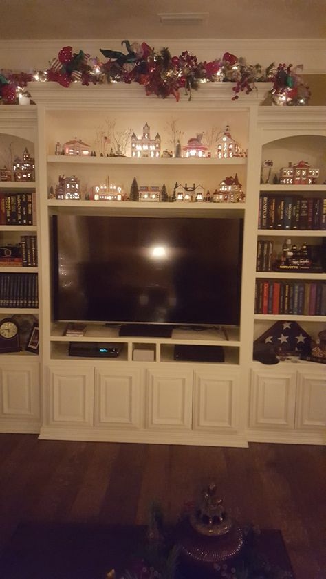 Christmas Wall Unit Decor, Christmas Decor For Entertainment Center, Glass Entertainment Center, Built In Tv Wall Unit, Wall Unit Decor, Village People, Traditional Christmas Decorations, Bedroom Fireplace, Santa Figurines