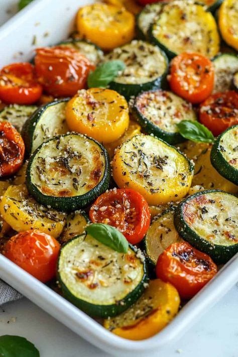 A baking dish filled with colorful, roasted zucchini, yellow squash, and tomatoes, topped with melted Parmesan and fresh basil. Garlic Parmesan Zucchini, Spinach Gratin, My Heavenly Recipes, Zucchini Yellow Squash, Creamy Mashed Cauliflower, Heavenly Recipes, Cherry Tomato Salad, Roasted Zucchini, Honey Roasted Carrots