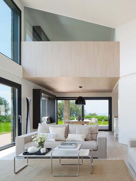 The black window frames create a pleasing contrast against the cream colored interior. Barcelona Nature, House In Barcelona, Nature House, Skillion Roof, Architecture Renovation, Warm Color Schemes, House In Nature, Country Homes, Van Der Rohe