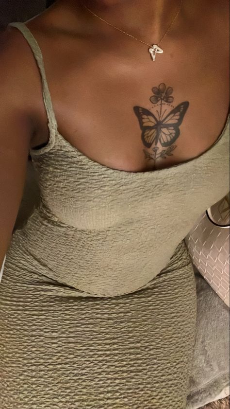 #tattooideas #butterflytattoo #tattoosforwomen #tattoo Girl Chest Tattoo Ideas For Women Black, Tattoos Black Women Dark Skin, Butterfly Tattoo Brown Skin, Tattoo For Dark Skin Women, Tattoo Ideas On Chest For Women, Women Tattoos Chest, Small Tattoos On Dark Skin, Butterfly Between Breast Tattoo, Chest Tattoo Black Women