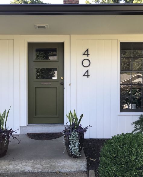 Large modern house numbers Green front door. Palm Leaf Sherwin Williams Black And White House Green Door, Green Black And White House Exterior, White House Green Door Black Shutters, Olive Green Front Door White House, White House Exterior Front Door Colors, Green Black Front Door, Army Green Front Door, Green Door Black Trim, Black And White House Exterior With Colored Door