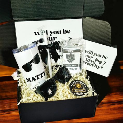 Get ready for the cutest ring security officers at your wedding and pop the question with our personalized Ring Bearer Proposal Boxes! 🕶️💍 Calling all 2025 brides-to-be, tag a friend! 👰‍♀️ . . . . #customgifts #2025weddings #ringbearer #smallbusinessowner #shopsmall #etsyhandmade #bridesquad #personalizedgift #weddingideas #customgifts #weddingluxe #weddingplanning #weddinginvitations #weddingfavors #brides #instabride #shesaidyes #engaged #shesaidyes #dreamwedding Ring Bearer Security, Ring Bearer Proposal, Ring Bearer Gift, Security Badge, Proposal Boxes, Ring Security, Ring Bear, Ring Bearer Gifts, Ring Bearer Box