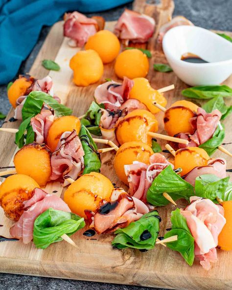 Whip up elegance on a stick with these Melon Prosciutto Skewers! Perfect for any gathering, these skewers blend sweet melon with savory prosciutto for a delightful bite. #MelonProsciuttoSkewers #EasyElegantAppetizers Prosciutto Skewers, Elegant Appetizers, Skewer Recipes, On A Stick, Party Foods, Side Recipes, Amazing Recipes, A Stick, Christmas Recipes