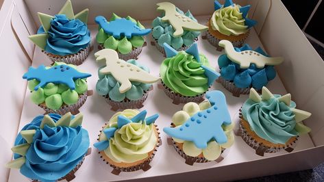 Blue and green themed dinosaur fondant topper cupcakes Dinosaur Cupcake Toppers Fondant, Dino 1st Birthday Cupcakes, Blue Dinosaur Cupcakes, Mini Dinosaur Cupcakes, Blue And Green Themed Birthday Party, Blue And Green Dinosaur Party, Dinosaur Cake And Cupcakes, Blue And Green Dinosaur Cake, Dinosaurs Cupcakes Ideas