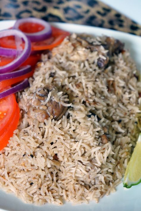 Deliciously spiced east African rice pilaf locally called Pilau. This chicken Pilau is an elevated chicken and rice recipe that is very easy to make.