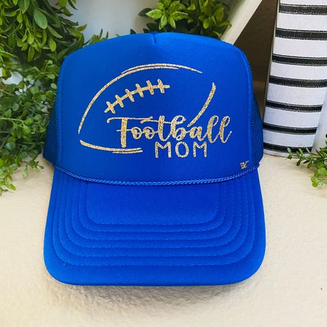 "Show your spirit by wearing this \"Football Mom\" hat! Your child will be so excited to see you wearing it and representing their favorite sport. ❤ One size, snapback ❤ Foam front  ❤ Curved Bill ❤ Made with glitter heat transfer vinyl" Football Mom Hat Ideas, Football Hat Designs, Hats Ideas, Hat Burning, Football Mom Gifts, Mama Hat, Hat Bar, Mom Hat, Glitter Heat Transfer Vinyl