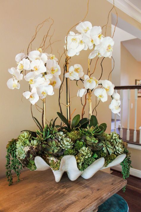 Tropic-Life Plants Green Orchid Arrangement, Large Orchid Centerpiece, Orchid On Kitchen Island, Glam Plant Decor, Large Floral Arrangements Home, Large Orchid Arrangement, Orchid Table Arrangements, Floral Arrangements With Orchids, Florida Centerpieces