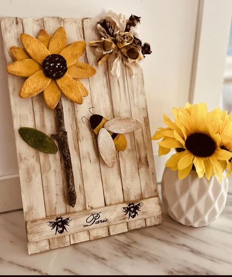 Inspirations by Lisa | Wood biscuit sunflower 🌻 and bee 🐝 ….painted and stained paint stir stick fence for background and a fabric rosette bow | Facebook Paint Stir Stick Crafts, Stick Fence, Wood Biscuits, Sunflower And Bee, Paint Stir Sticks, Fabric Rosette, Honey Bee Decor, Towel Dress, Hanger Diy