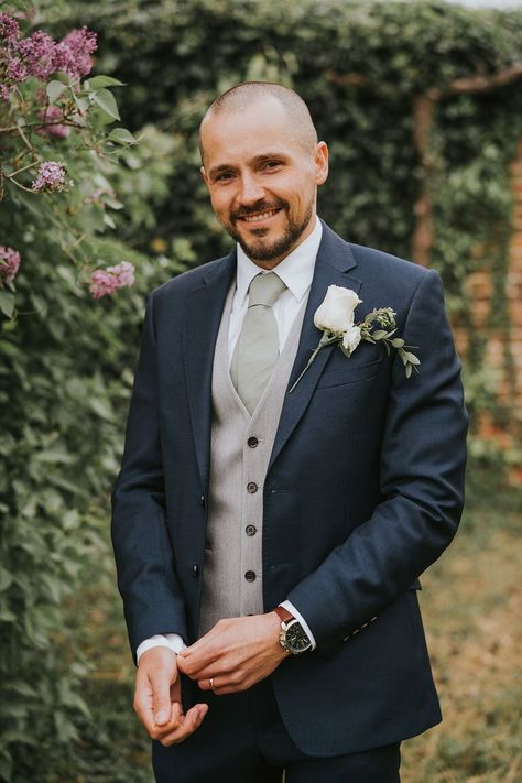 groom in navy three piece suit Navy Suit Waistcoat, Navy Suit With Vest Wedding, Blue Suit Green Waistcoat, Navy And Green Groom, Grooms Suit Navy Blue, Groom Style Navy Suit, Navy And Sage Suit Wedding, Navy Suit Grey Waistcoat Wedding, Grooms Man Suits Wedding Ideas