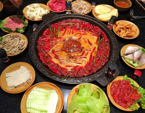 Chinese hotpot is one of the most popular meals in China. It consists of a simmering metal pot with broth at the center of a table, and all raw ingredients placed beside the metal pot, so people can add and cook whatever they like in the broth. Chengdu is famous for its spicy Sichuan style hot pot. Most Popular Meals, Popular Meals, Chinese Hotpot, Spicy Hot Pot, Hotpot Restaurant, Sichuan Food, Chengdu, Personal Brand, Hot Pot