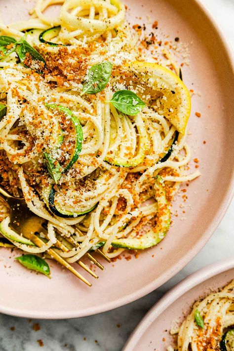 This light & bright Lemon Zucchini Pasta is a celebration of summer! Toss julienned zucchini squash with al dente pasta in simple garlic-infused lemon olive oil sauce. Finish with basil, parmesan, & crispy breadcrumbs for the best easy & healthy summer dinner. Ready in 25 minutes! Naturally meatless. Easily vegetarian & vegan. #zucchinipasta #zucchinipastarecipes #zucchinirecipes #zucchininoodles #pastarecipes #pastadishes #summerdinnerrecipes #summerdinnerideas #easydinnerideas #dinnerrecipes Lemon Zucchini Pasta, Zucchini Pasta Recipes, Easiest Dinner, Lemon Garlic Pasta, Summer Zucchini, Lemon Zucchini, Crispy Garlic, Squash Pasta, Dish Ideas