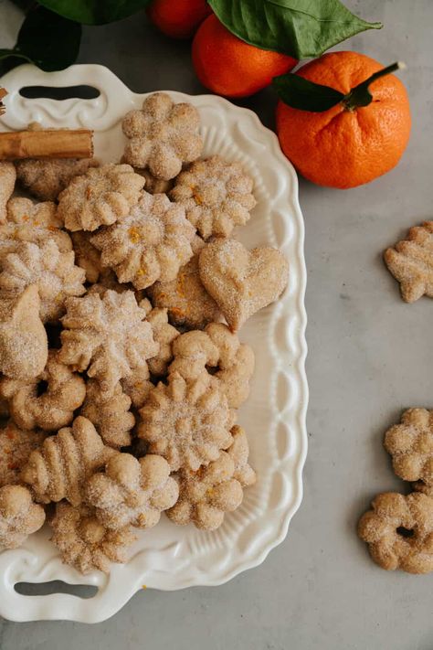 Celebrate the holidays with Orange Biscochos! These festive cookies feature a zesty mix of orange juice, liqueur, and zest, creating a soft, crumbly texture. Rolled in cinnamon sugar with added zest, they're a citrusy delight. Perfect for Christmas gatherings, each batch makes plenty to share. Enjoy this unique, flavorful twist on a traditional treat, bringing a burst of orange to your festive table. These biscochitos de naranja are not just cookies; they're a holiday experience! Easy Biscochitos Recipe, Latino Desserts, Biscocho Recipe, Biscochito Recipe, Pinwheel Sugar Cookies, Sunday Cooking, Cinnamon Twist, Mexican Cookies, Mexican Desserts