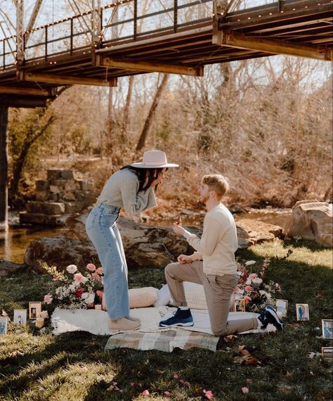 Nighttime Proposal Ideas, Fall Picnic Proposal, Outside Engagement Ideas, Proposal With Pictures Hanging, Spring Proposal Outfit, Cottage Core Proposal, Surprise Engagement Proposals Ideas, Picnic Proposal Photoshoot, Purposing Ideas Proposals