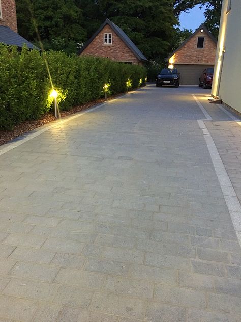 Beautiful contemporary design driveway using Marshalls grey granite paving. Click the link to see more photos of this garden and product details. Front Driveway Ideas, Front Garden Ideas Driveway, Block Paving Driveway, Garden Ideas Driveway, Driveway Entrance Landscaping, Modern Driveway, Granite Paving, Driveway Paving, Driveway Lighting