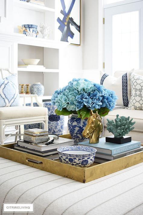 Spring coffee table styling with blue faux hydrangeas, design books, coral and beautiful objects. #springdecorating #coffeetablestyling #coffeetableideas #fauxhydrangeas #homedecoraccessories Coffee Table Decor Living Room, Table Decorating, Table Decor Living Room, Coffee Table Tray, Coffee Table Styling, Decor Pillows, Design Del Prodotto, Living Room Coffee Table, Coffee Table Design