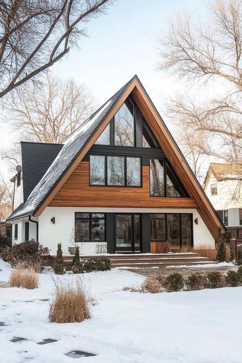 Modern A-frame house with wood and glass facade. These Scandinavian modern houses are a hug of architecture — a sleek, nordic sanctuary with a dash of whimsy. Swiss Chalet House Exterior, Modern A Frame House, Scandinavian Modern House, Nordic Houses, Colorado Cabin, Modern A Frame, Cabin Style Homes, Glass Facade, Dream Cabin