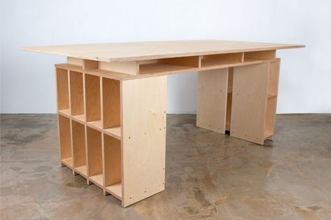 This table also serves as storage for your working and display needs - Yanko Design Plywood Desk, Plywood Table, Retail Store Interior Design, Shelf Furniture, Studio Table, Plywood Furniture, Yanko Design, A Desk, Work Table