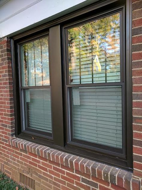 Bronze double hung windows with vertical grids in top sashes and bronze aluminum capping around the outside. Brown Aluminium Windows, House Exterior Windows, Bronze Windows Exterior, Brown Windows, Black Vinyl Windows, Windows House, Metal Window Frames, Harvey House, Exterior Windows