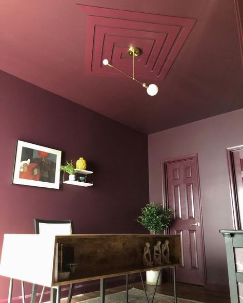 LOBBY SCENE, dark, warm purple-red paint color by Backdrop. – Dark, Purple, Red, Office, Ceiling | Backdrop Long Pendant Light, Backdrop Paint, Long Pendant Lights, Red Paint Colors, Warm Purple, Red Backdrop, Interior Wall Paint, Wall Installation, Beautiful Lighting