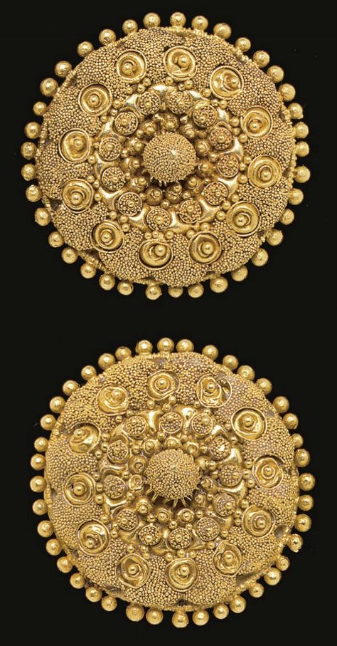 A PAIR OF ETRUSCAN GOLD DISKS   CIRCA LATE 4TH CENTURY B.C.   Each formed of domed sheet, encircled by granules, elaborately adorned in concentric rings, with clusters of granulation, filigree spirals centered by granules, clusters of granulation around larger granules, centered by a piriform knob embellished with granulation; mounted as earrings with modern gold backs and posts Etruscan Jewelry, Ancient Jewels, Roman Jewelry, Ancient Jewellery, Historical Jewellery, Art Ancien, Art Antique, Ancient Jewelry, Ancient Cultures