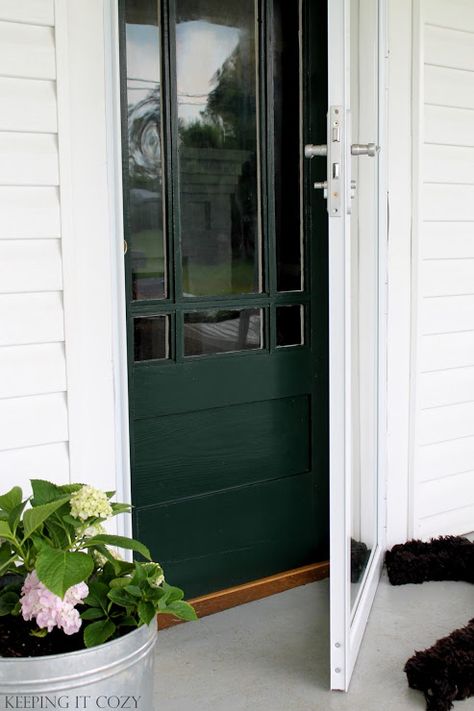 Benjamin Moore Essex Green Paint. Keeping It Cozy: Porch Update: The Front Door Black And Wood House Exterior, Benjamin Moore Essex Green, Paint Porch, Porch Update, Paint Benjamin Moore, Green Front Door, Painted Exterior Doors, Essex Green, Black Exterior Doors