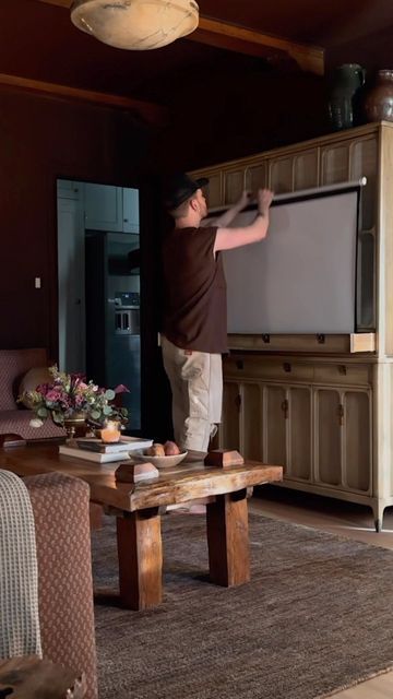 Projector Screen Living Room, Projector Screen Ideas, Projector Screen Diy, Lone Fox, Hidden Projector, Seattle Apartment, Projector Stand, Vintage Hutch, Diy Projector