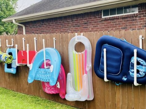 Hanging Pool Float Storage Ideas, Floatie Storage, Float Storage For Pools, Pool Supply Storage Ideas, Pool Floaties Storage Ideas, Garage Reorganization, Diy Pool Float Storage, Pool Toy Storage Ideas, Pool Float Storage Ideas