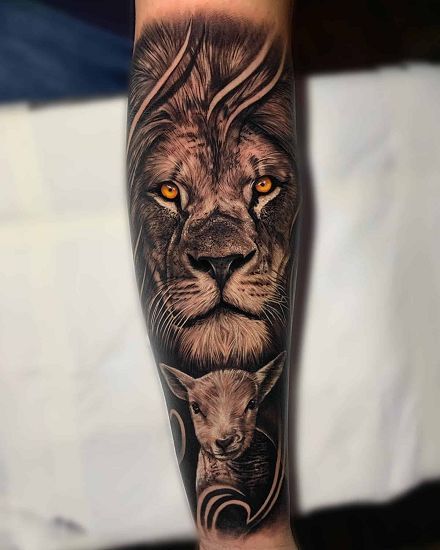 Discover the world of lion tattoos in our article. From deep symbolism and rich history to placement options and best designs. Lion Flames Tattoo, Lion And The Lamb Tattoo, Lamb Tattoo, Couple Tat, Lion And The Lamb, Lion Lamb, Biblical Tattoos, God Tattoo, Lion Tattoo Sleeves