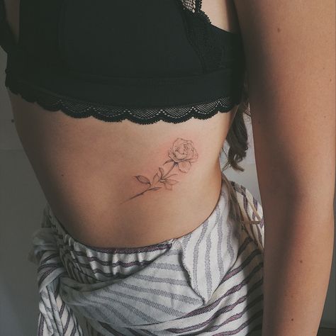 Rose Tattoo On Waist, Fine Line Rose Rib Tattoo, Rose On Ribs Tattoo, Roses Rib Tattoo, Rose Tattoo Rib Cage, Rib Cage Rose Tattoo, Rose Tattoo On Ribs, Rib Rose Tattoo, Rose Between Breast Tattoo