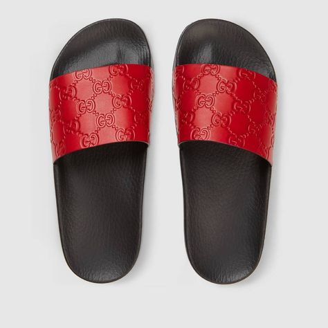 Shop the Gucci Signature slide sandal by Gucci. A Gucci Signature slide sandal. Made in heat debossed Gucci Signature leather resulting in a defined print with a firm texture. Gucci Fashion Show, Sandals Gucci, Red Leather Shoes, Red Slides, Design Slide, Red Leather Sandals, Gucci Slides, Designer Slides, Gucci Sandals