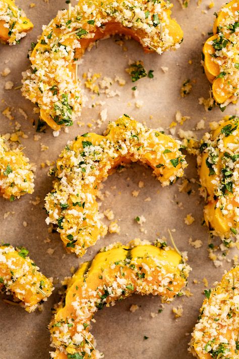 Close up photo of delicata squash with a garlic and herb breading before baking Parmesan Crusted Delicata Squash, Delicate Squash, Garlic Herb Bread, Fruit Sides, Delicata Squash Recipe, Roasted Delicata Squash, Bread Roast, Recipes Veggie, Fresh Olives