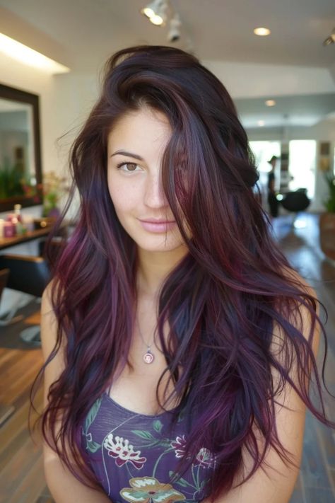 Woman with long, wavy hair tinted in shades of purple and red, standing in a salon. Dark Brunette Hair With Red Undertones, Cherry And Black Hair, Pomegranate Hair Color, Brown Hair With Maroon Highlights, Chocolate Cherry Highlights, Dark Maroon Hair Burgundy, Brown Hair No Red Tones, Blackish Red Hair, Red Hair With Black Highlights