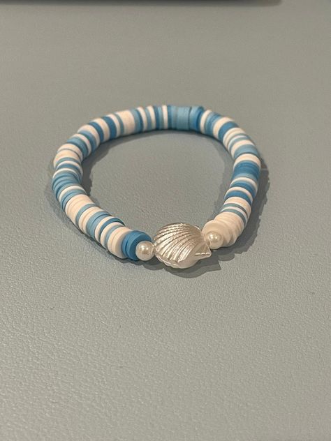 blue and white shell bracelet (beachy ocean vibes Beach Jewelry Bracelets, Coastal Clay Bead Bracelet, Coastal Bracelet Ideas, Cute Clay Bead Bracelet Ideas For Summer, Diy Beachy Jewelry, Beachy Bracelets Clay Beads, Beachy Bracelet Ideas, Beachy Clay Bead Bracelet, Beach Bracelet Ideas