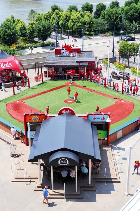 Kroger Fan Zone kids area at a Cincinnati Reds game at Great American Ballpark! Click or visit FabEveryday.com for my stadium review plus tips, recommendations, and details for visiting Cincinnati! Pin to your travel ideas boards! #hosted #hilton #homewoodsuites #roadtripofdreams #cincinnati #travelwithkids #familytravel #baseballfamily #visitcincinnati #ohio #baseballroadtrip #cincinnatireds #redstockings #baseball #roadtrip #familyroadtrip #midwestroadtrip #travelblog #wanderlust #fabtravel Great American Ballpark, Backyard Sports, Midwest Road Trip, Baseball Family, Downtown Cincinnati, Baseball Park, Hilton Hotels, Baseball Stadium, Kids Baseball