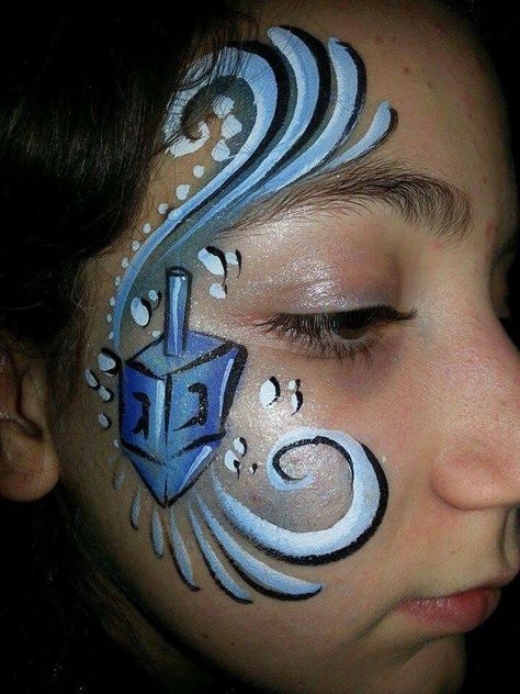 Hanukkah dreidel Hanukkah Face Paint, Hanukkah Makeup, Purim Ideas, Kids Face Painting, Christmas Face Painting, Hanukkah Dreidel, Jewish Crafts, Face Painting Inspiration, Hanukkah Party