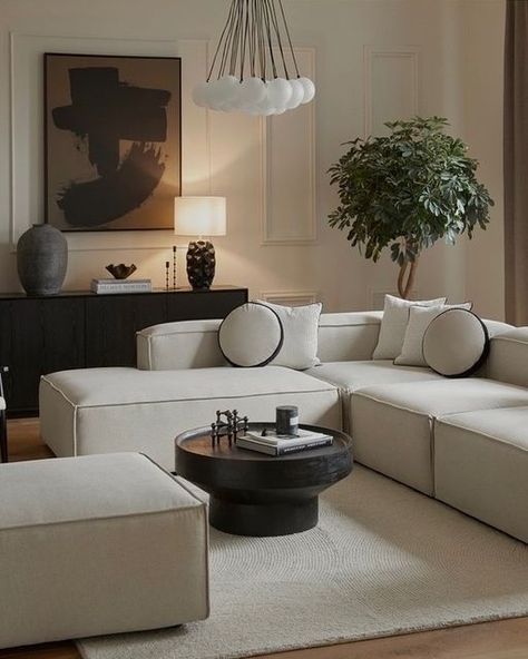 Beige Couch With Black Coffee Table, Black Beige Home Decor, Brown Black And White Living Room Minimalist, Black Furniture Design, Beige Interior With Black Details, White Sofa Black Coffee Table, Cream Sofa Black Coffee Table, Black White Beige Home Decor, Living Room Decor With Black Accents