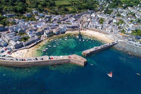 A gloriously renovated house right on the water's edge in a beautiful Cornish fishing village — for sale for £1.1 million - Country Life Mousehole Cornwall, Castle Backdrop, Aerial Images, Uk City, Beach Retreat, Isles Of Scilly, Fishing Villages, Crystal Clear Water, Sandy Beaches