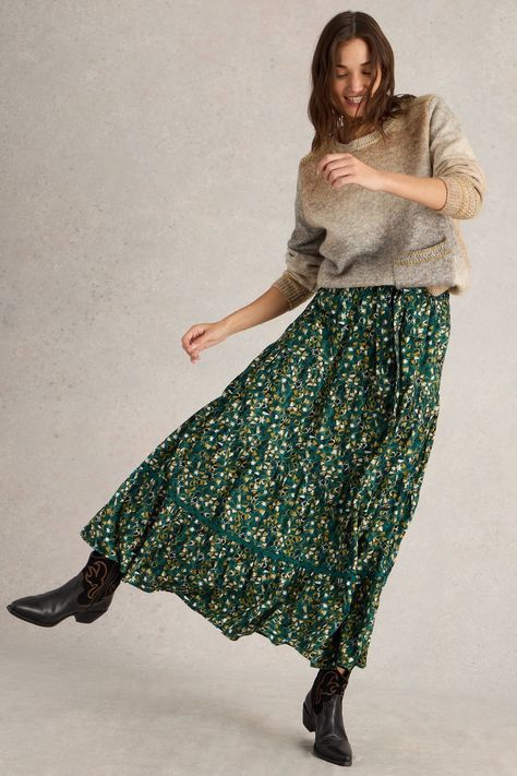 There's something about this organic cotton maxi skirt that makes us want to sweep across the countryside like a Jane Austen heroine. Though we prefer to team ours with cowboy boots and jumpers. (Petticoats and aprons aren't really our thing.) Machine washable. 100% Organic cotton. Skirt Cowboy Boots, Cotton Maxi Skirt, Green Maxi Skirt, Cotton Maxi Skirts, Maxi Skirt Outfits, Skirts With Boots, Tiered Maxi Skirt, White Stuff, Cotton Maxi