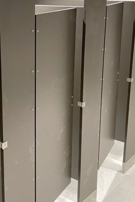 There's a lot more that goes into installing toilet partitions (or bathroom stalls) than you might think. Take a closer look in our blog. 👉 Bathroom Stall Ideas, Bathroom Stalls, Commercial Bathroom, Bathroom Partition, Bathroom Stall, Bathroom Partitions, Bathroom Layout, Carpentry, Tall Cabinet Storage