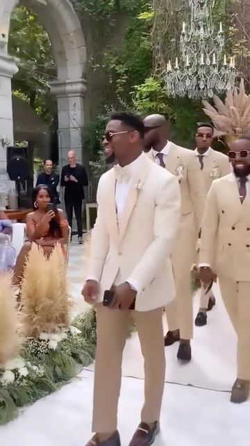 Everythingwedding Global on Instagram: "We love seeing y’all show love to the Groom and Groomsmen! It’s their day too!! ❤️ 💐 But we’re ready to see what the Ladies are looking like if this is just the beginning of the Wedding Party 🙌🏾 🎥 @mrtn.dbrh #groomsmen #groom #mensfashion #father #marriagegoals #instadaily #vows #baby #instagood #energy #reels #style #bridesmaids #happy #explorepage #blacklove . #explore #fashion #weddingphotography #luxury life #goodvibes #trending #photooftheday #vi Trending Grooms Suits, Cream Wedding Suit Black Man, Gold And White Groom Suit, Champagne Gold Groomsmen Attire, Groomsmen Neutral Colors, Champagne Groomsmen Suits, Brown And Beige Wedding Theme, White And Gold Wedding Party, Groomsmen Attire Gold