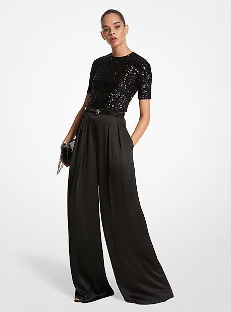 A masterclass in everyday sophistication, these palazzo pants are finely tailored in Italy from liquid-like satin and dyed in a versatile noir hue. The mid-rise silhouette features finely pressed creases that lend effortless movement with each step. Further accentuate the dramatic wide-leg cut with soaring high-heel sandals. Glamorous Luxury Pants For Date Night, Wide Leg Pants Dressy Outfit, Womens Cocktail Attire Pants Evening Party, Black Trousers Outfit Dressy, Palazzo Pants Outfit Formal, Palazzo Pants Cocktail Outfit, Cocktail Outfit Pants Women, Wide Leg Pants Outfit Party, Luxury Silk Wide Leg Pants For Evening