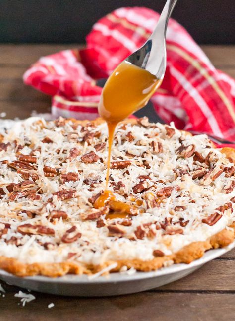 A cream cheese filling is topped with toasted pecans, coconut, and caramel sauce in this incredible pie! Pecan Cream Cheese Pie, Cool Whip Pies, Pecan Milk, Pecan Turtles, Caramel Pie, Tropical Desserts, Pecan Cheesecake, Cream Cheese Pie, Chocolate And Caramel