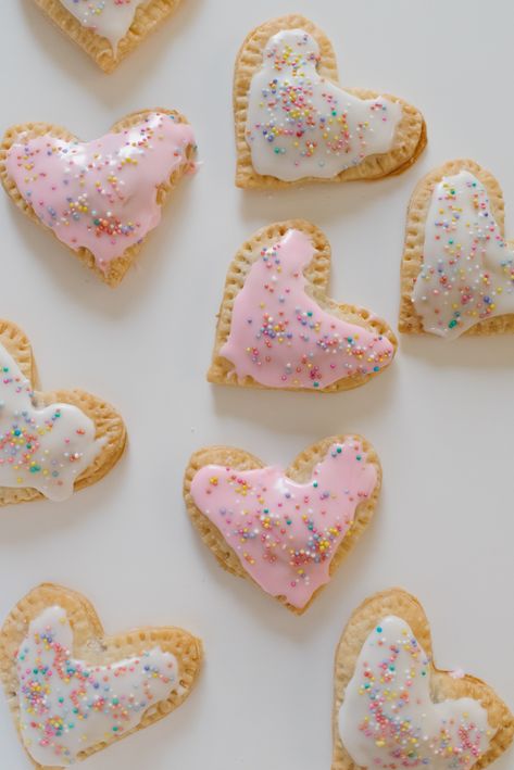 Homemade Valentine's Day treats are some of my absolute favorites to make, so if you're looking for a little recipe inspiration to celebrate love, we have the ultimate list with more than 50+ incredible recipes to try this February, including these Heart Shaped Valentine's Day Pop Tarts. | glitterinc.com | @glitterinc Poptart Recipe, Strawberry Cake Easy, Heart Shaped Food, Valentines Baking, Heart Shaped Valentines, Valentines Day Cookies, Homemade Valentines, Valentine's Day Recipes, Valentines Day Treats