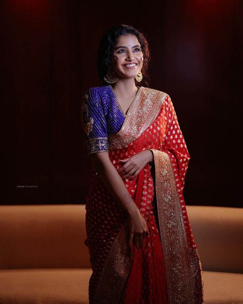 anupama parameswaran in a red saree by geethika kanumili for an event Red Blouse Outfit, Red Saree Blouse, Long Blouse Designs, Banaras Sarees, Blouse Designs Catalogue, Anupama Parameswaran, Silk Saree Blouse Designs, Blouse Designs Silk, Elegant Blouse Designs