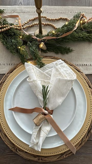 Use geometric ornaments, metallic accents, and a simple star or angel topper. Christmas Bell Napkin Ring, Gingham Christmas Table, Fancy Christmas Table Setting, Christmas Dinner Place Setting, Minimalist Christmas Table Setting, Christmas Tablescapes Round Table, Holiday Place Settings Christmas, Christmas Lunch Table Setting, Christmas Round Table Decorations